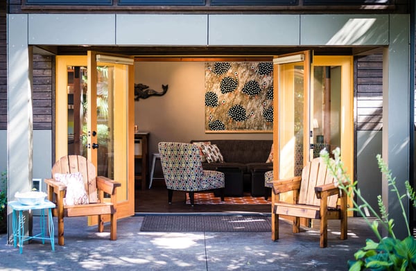 Cozy seating area with open patio doors at a remodeled ADU by CB Construction in Seattle