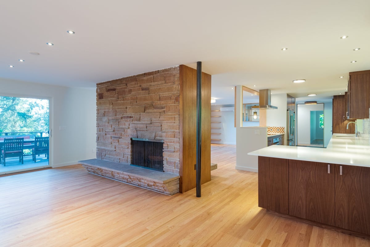 Custom living room design with floating shelves and minimalist decor, CB Construction, Seattle