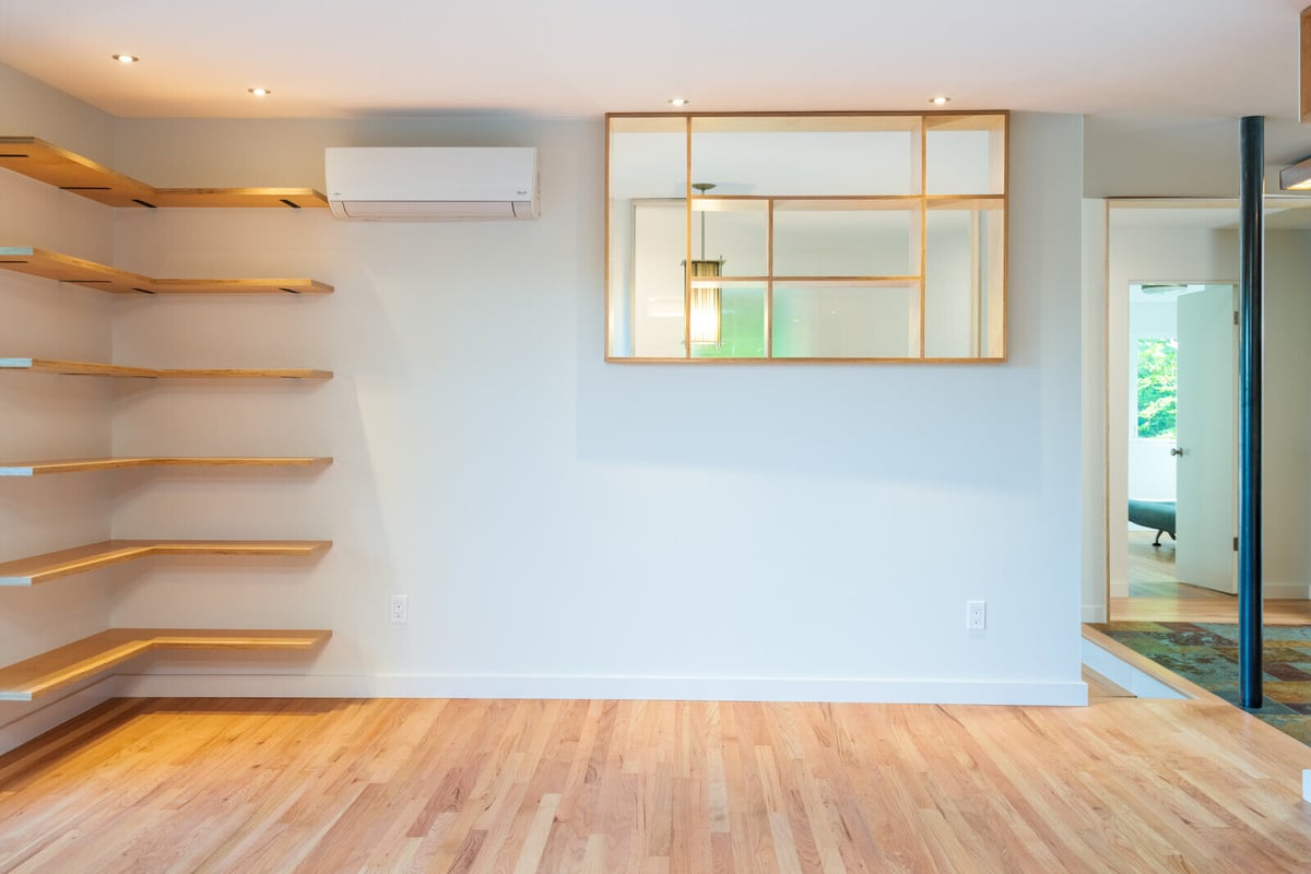 Living room with hardwood floors and a sleek shelving design, CB Construction, Seattle