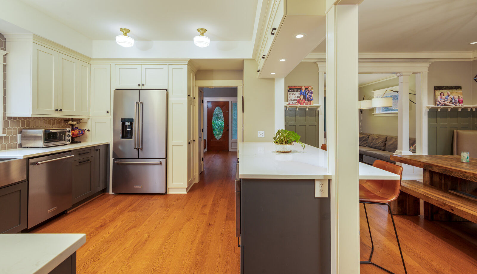 Modern kitchen with stainless steel refrigerator and custom cabinetry by CB Construction in Seattle