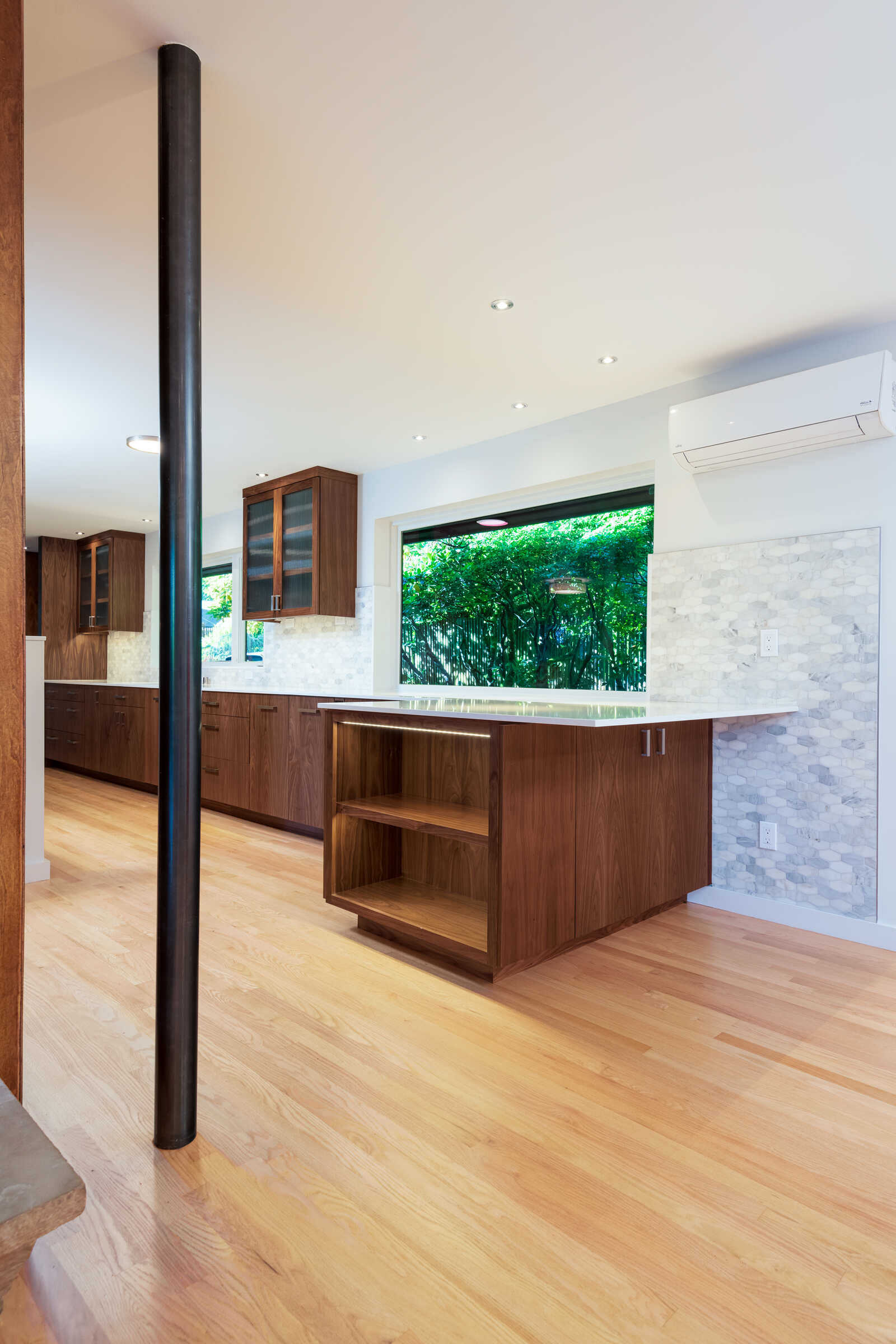 Custom kitchen with large wood island and minimalist design, CB Construction, Seattle